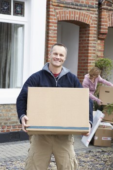 Professional movers handling household items