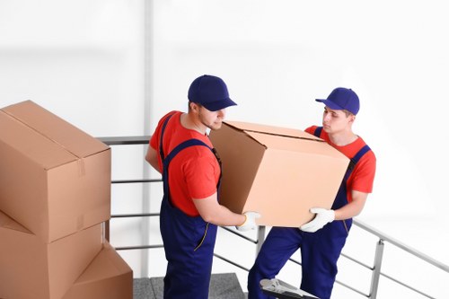 Professional movers handling furniture in Chalk Farm