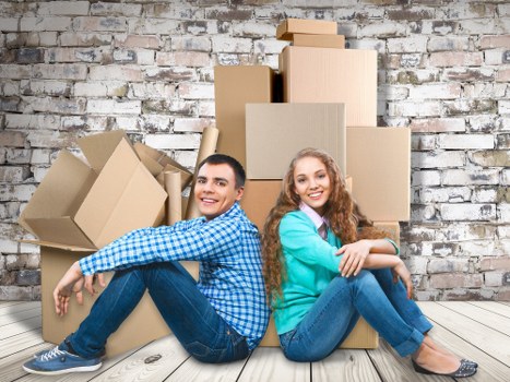 Trained Tommy Removals staff carefully moving furniture