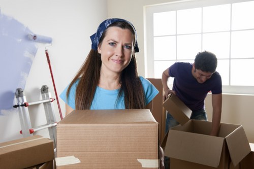 Packers carefully loading items into a moving van