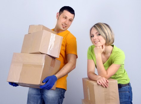 Customers smiling as Tommy Removals completes their move