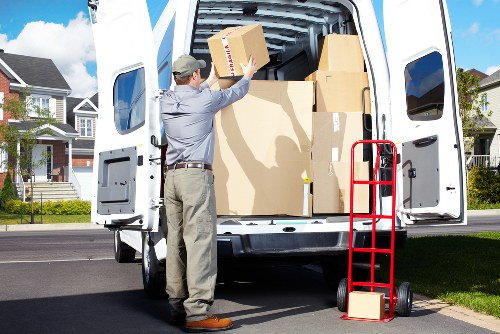 Satisfied customers unpacking their new home with Tommy Removals