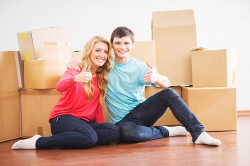 Removalists loading boxes into a moving van